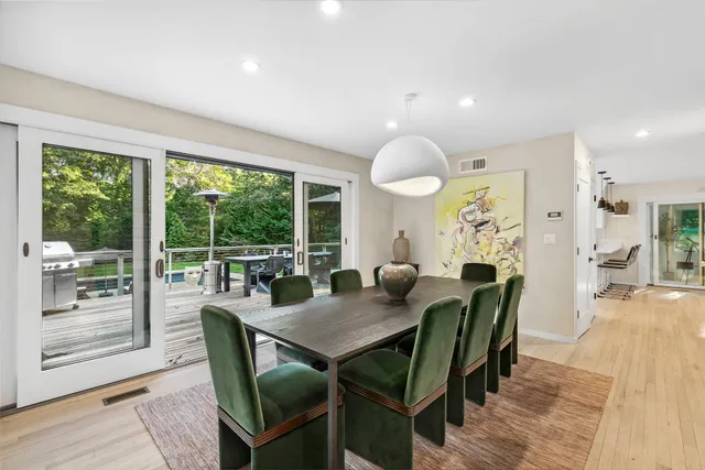a view of a dining room with furniture window and outside view