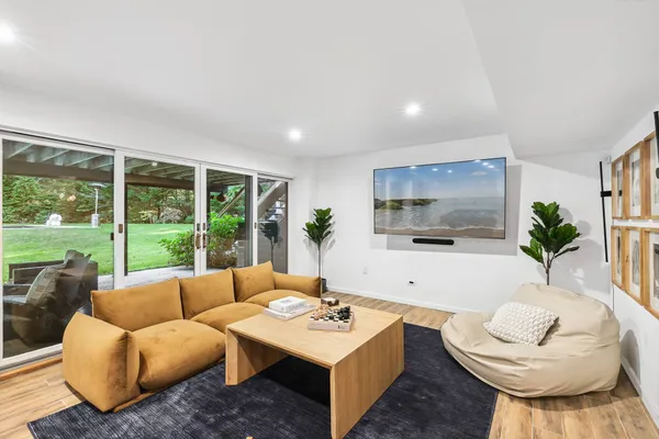 a living room with furniture and a large window