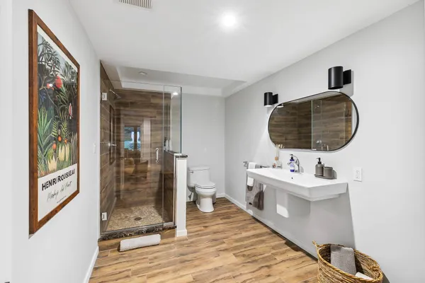 a bathroom with a double vanity sink and mirror