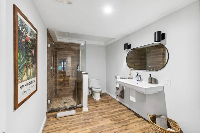 a bathroom with a double vanity sink and mirror