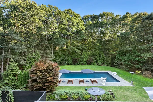 a view of an outdoor space with trees all around