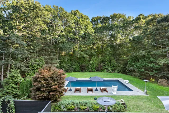 a view of an outdoor space with trees all around