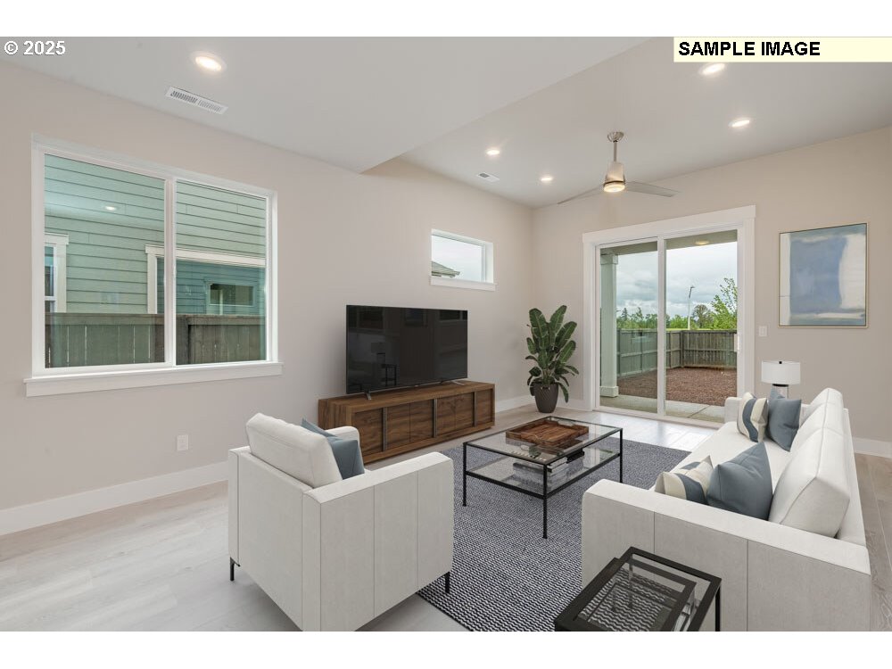 4511 South 39th Place Ridgefield, WA 98642 - Photo 3 of 10 a living room with furniture and a flat screen tv