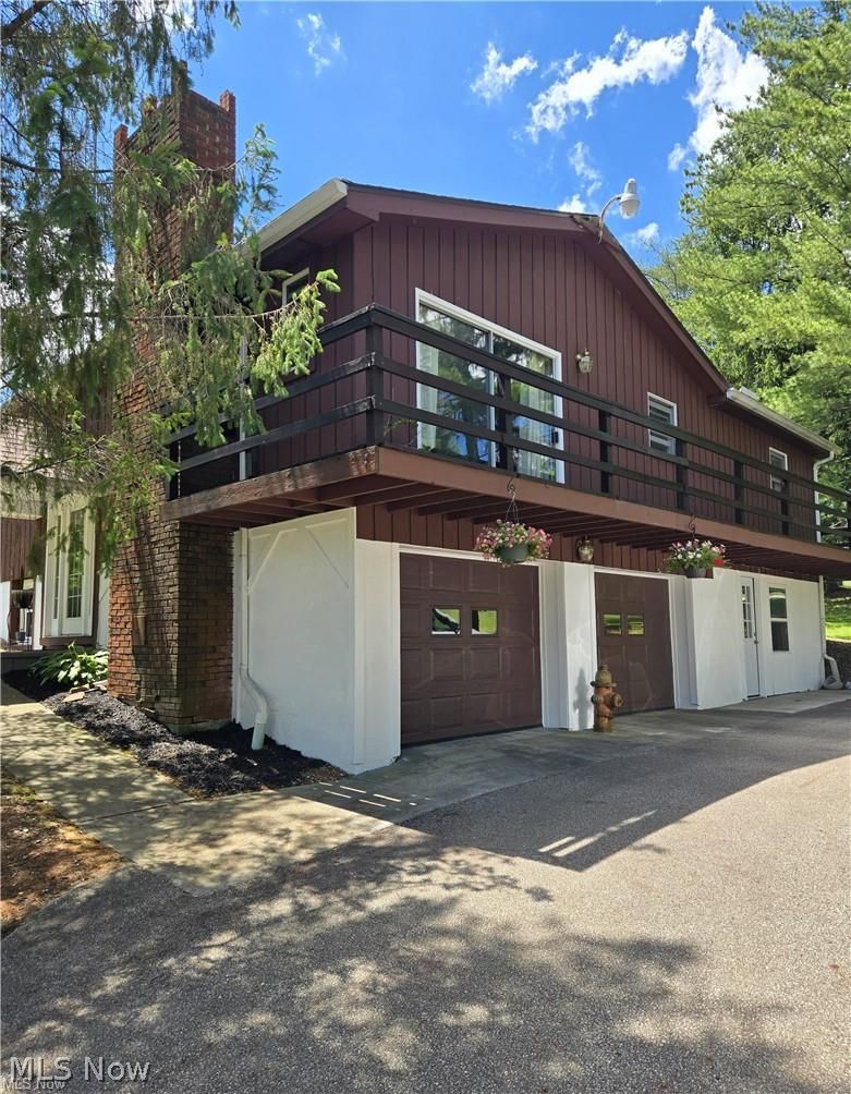 14640 Stone Road Newbury, OH 44065 - Photo 1 of 19 A balcony surrounds this hilltop home