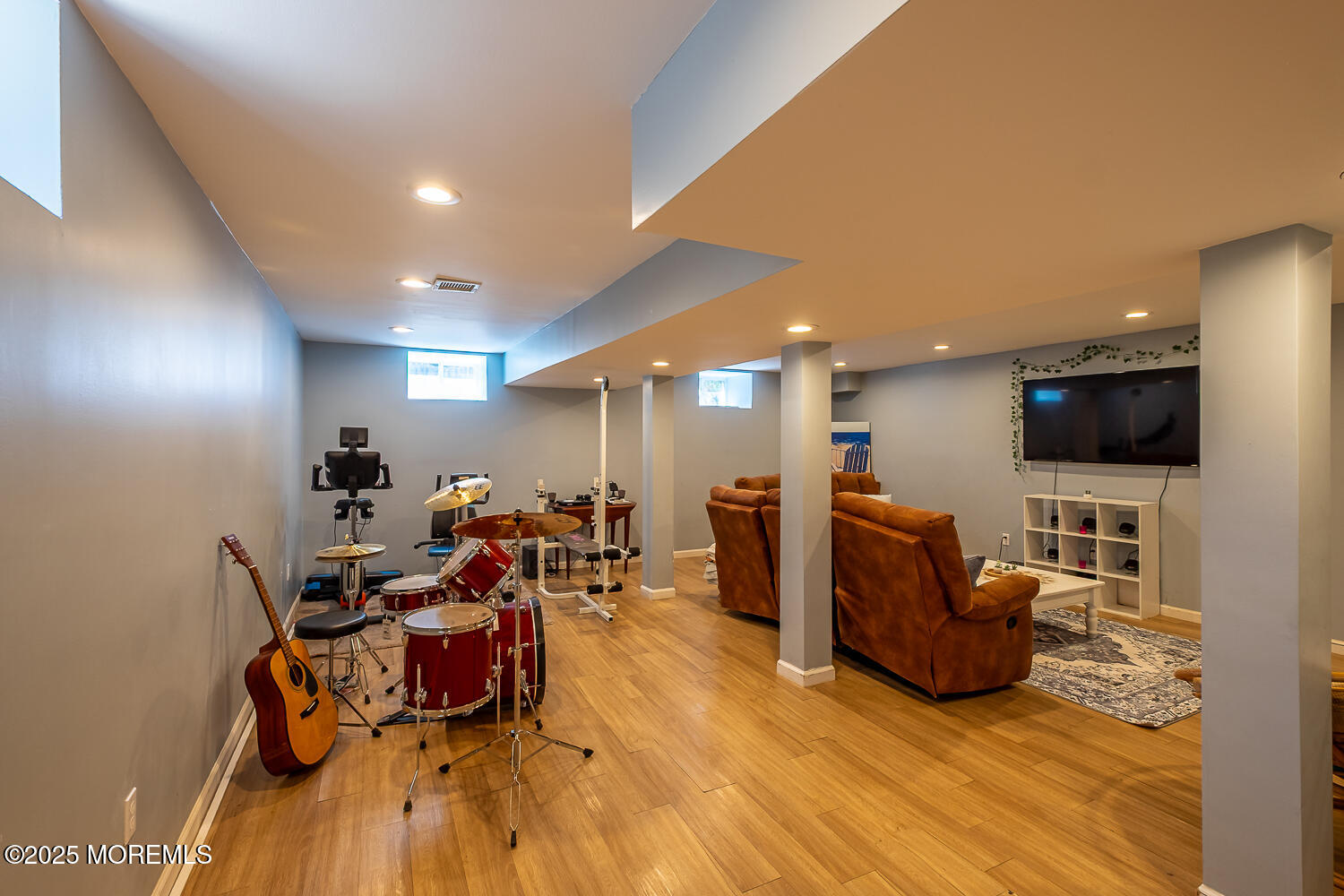 40 Gladiola Drive Howell, NJ 07731 - Photo 23 of 26 a living room with furniture and a flat screen tv