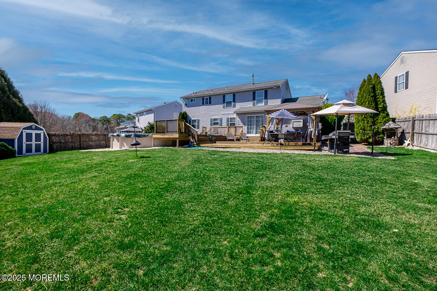 40 Gladiola Drive Howell, NJ 07731 - Photo 24 of 26 a view of a house with a big yard and sitting area