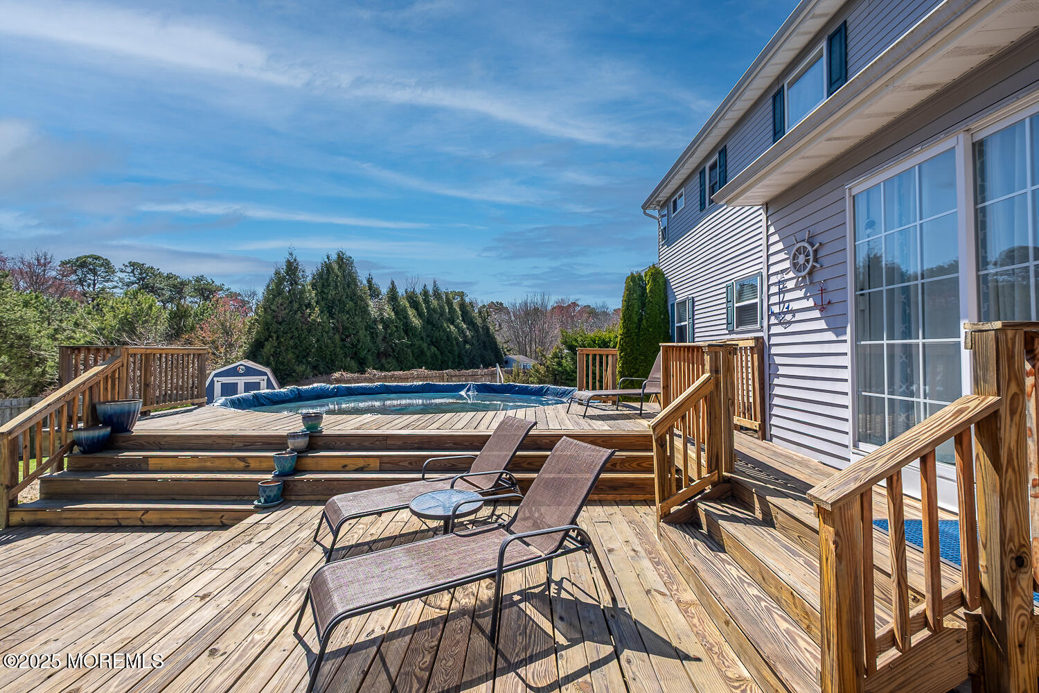 40 Gladiola Drive Howell, NJ 07731 - Photo 26 of 26 a view of a chairs and tables in the balcony