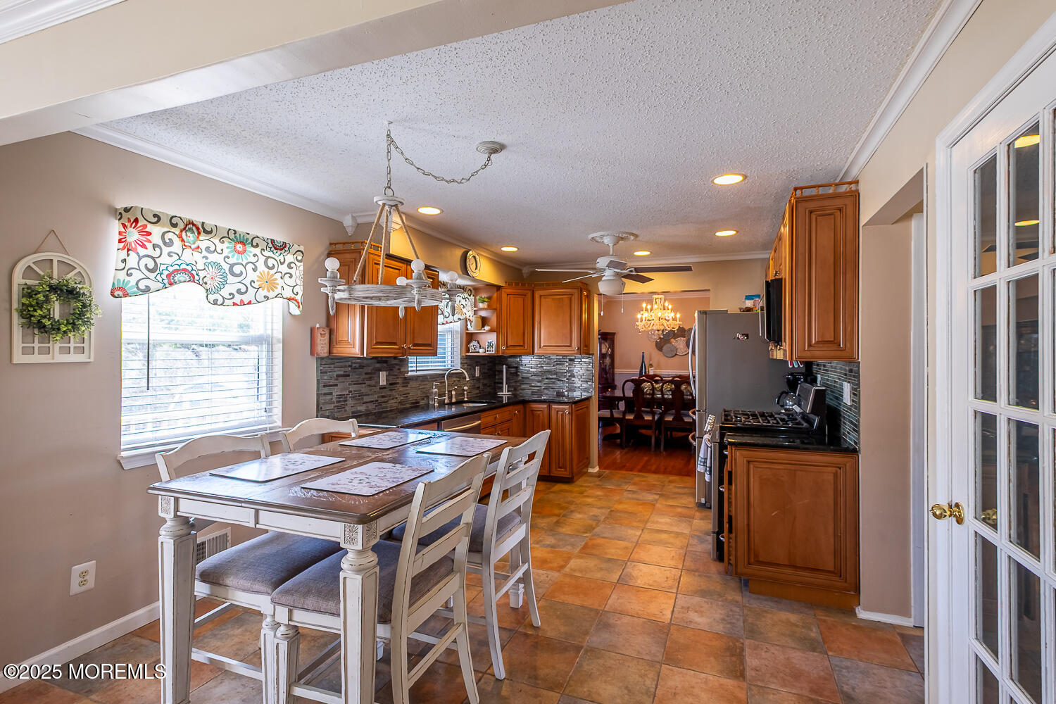 40 Gladiola Drive Howell, NJ 07731 - Photo 9 of 26 a kitchen with a table and chairs in it