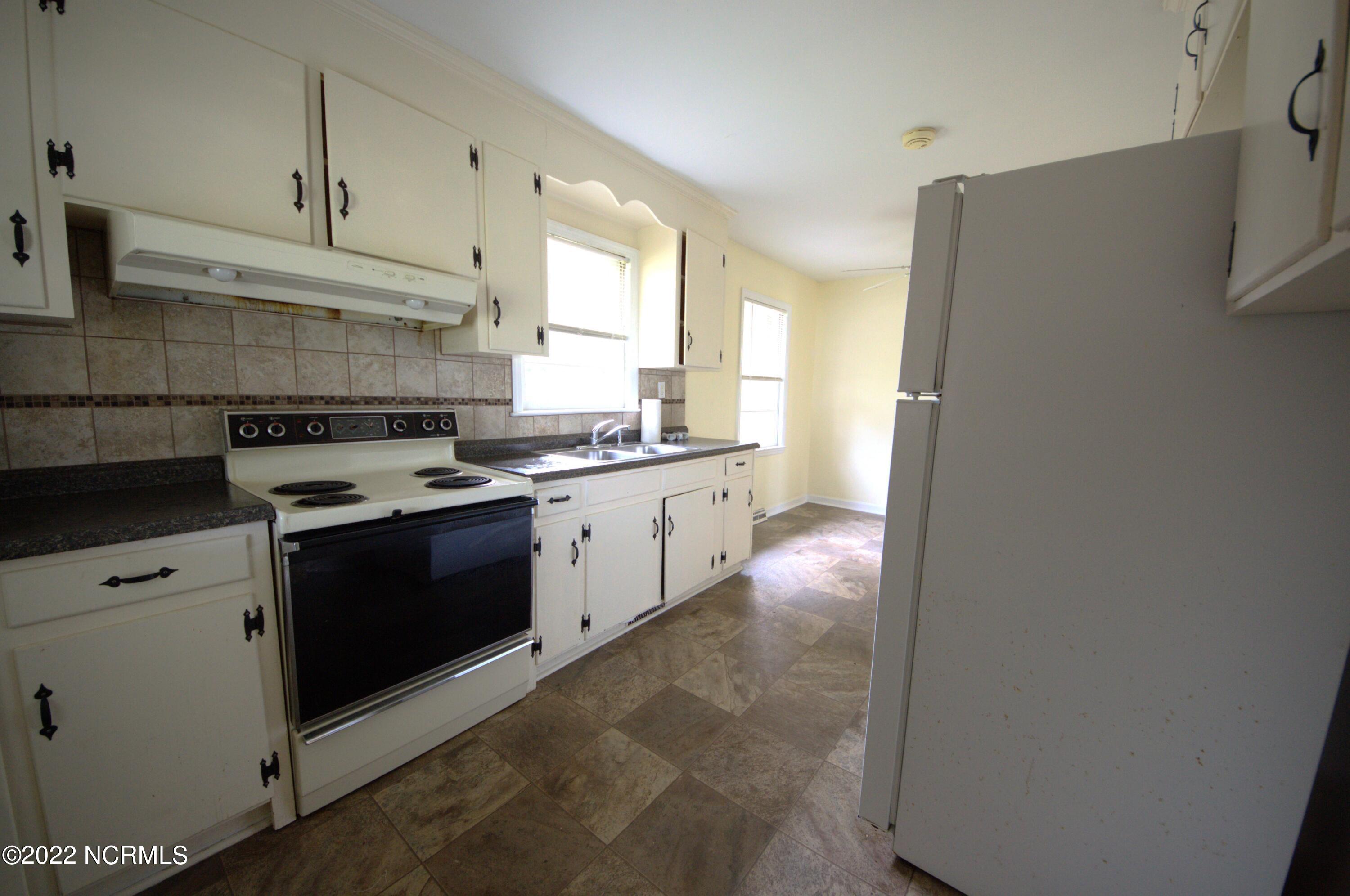 710 Country Club Road Jacksonville, NC 28546 - Photo 5 of 15 another cabinets of kitchen 710