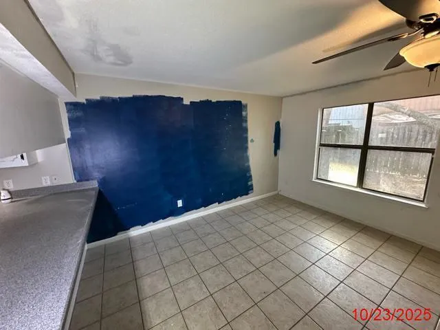 a view of an empty room and window