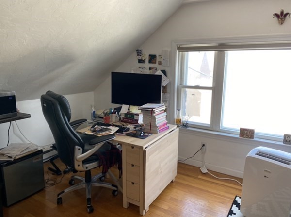 6 School Street, Unit 3 Chelsea, MA 02150 - Photo 3 of 10 a view of a workspace with furniture and a window