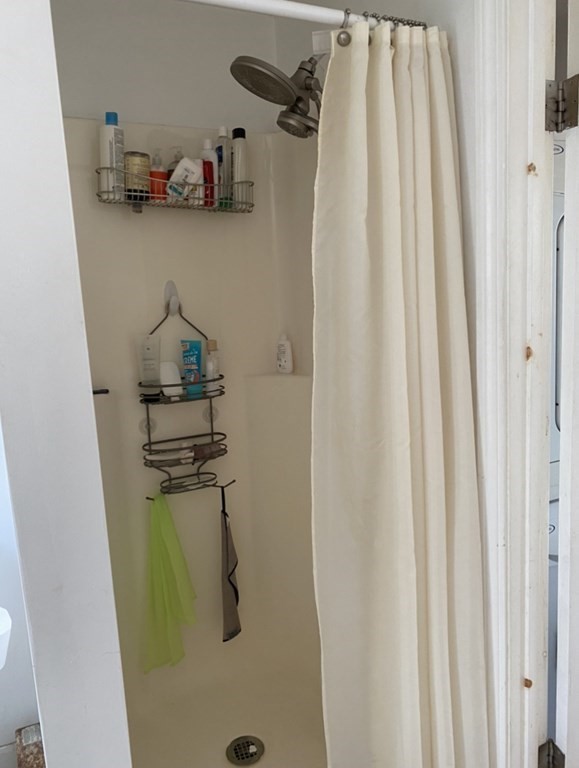 6 School Street, Unit 3 Chelsea, MA 02150 - Photo 7 of 10 a view of walk in closet with clothes and shoes
