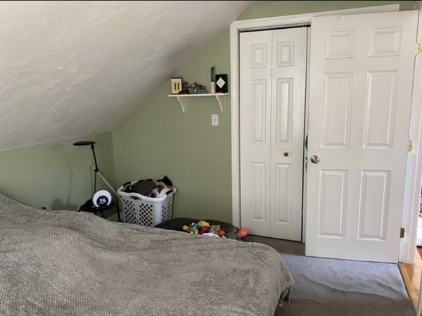 6 School Street, Unit 3 Chelsea, MA 02150 - Photo 9 of 10 a bedroom with a bed and a window