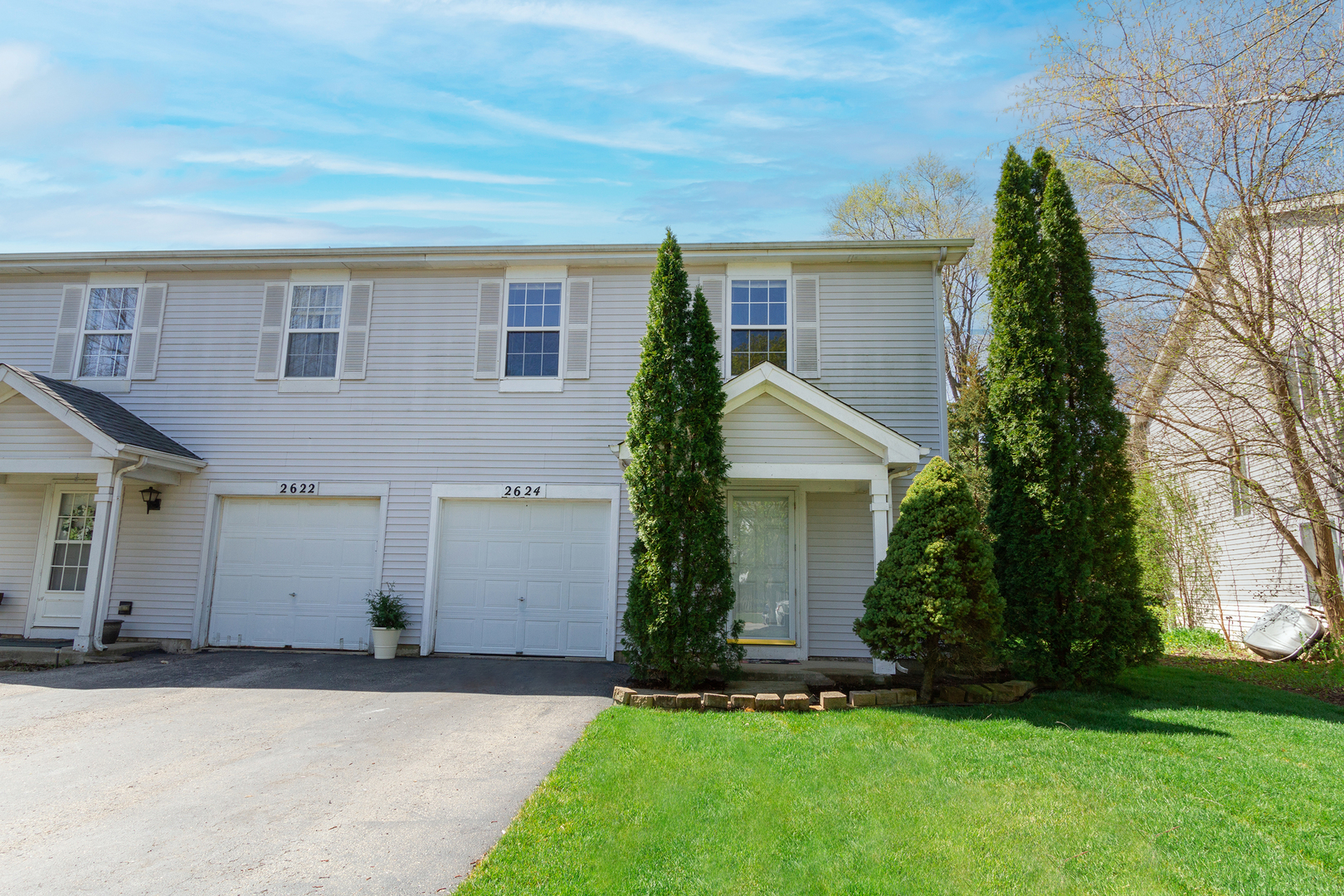 front view of a house with a yard