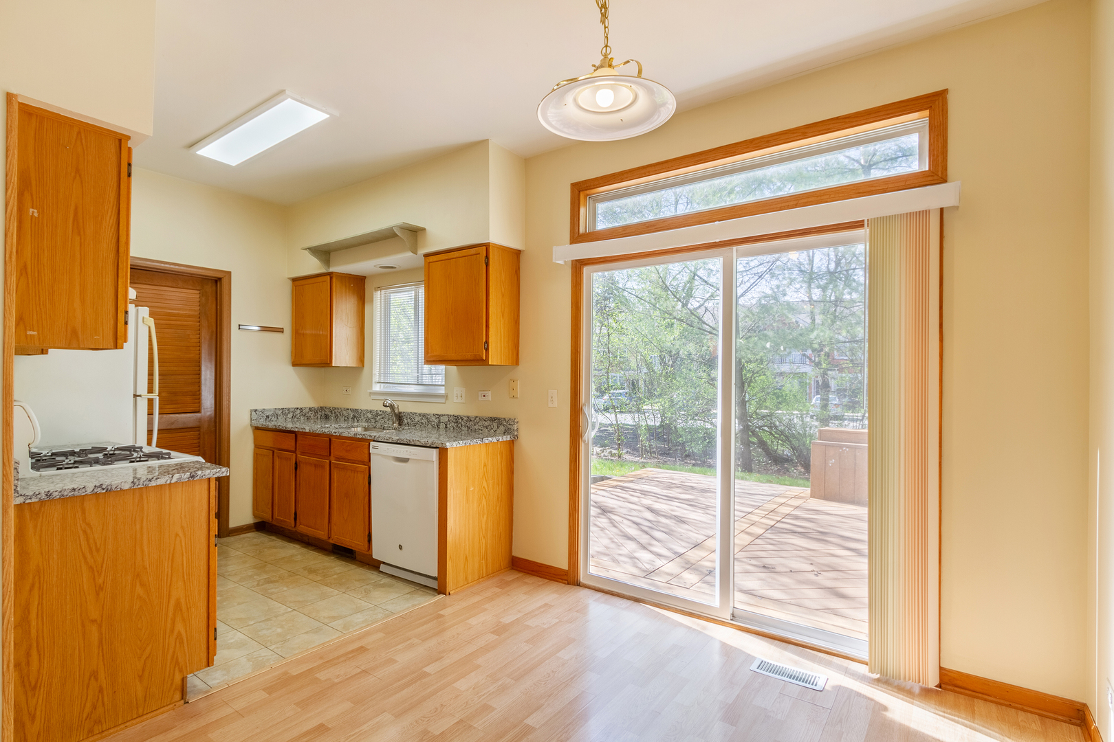 2624 Idaho Road Naperville, IL 60564 - Photo 8 of 23 a kitchen with granite countertop a sink and a stove top oven