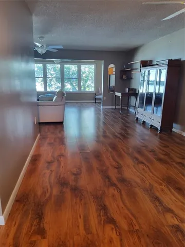 a view of livingroom with furniture and floor to ceiling window