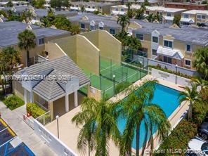 4590 Southwest 68th Ct Circle, Unit 8 Miami, FL 33155 - Photo 1 of 11 an aerial view of residential houses with yard