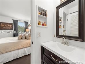 4590 Southwest 68th Ct Circle, Unit 8 Miami, FL 33155 - Photo 11 of 11 a bedroom with a bed and a sink