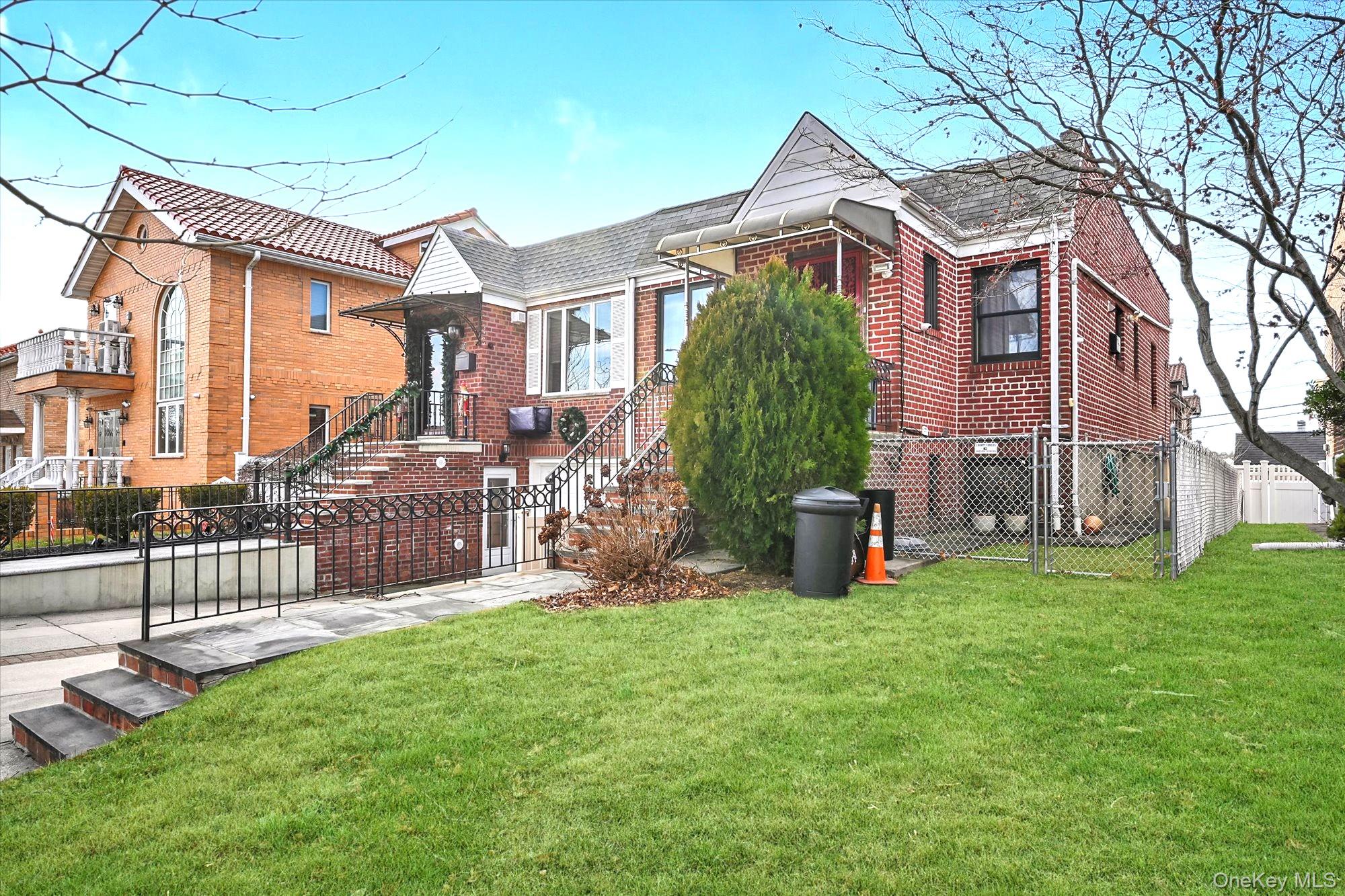 53-08 193rd Street Queens, NY 11365 - Photo 17 of 17 a view of a house with backyard and a tree
