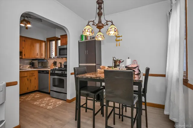 a kitchen with a table and chairs in it