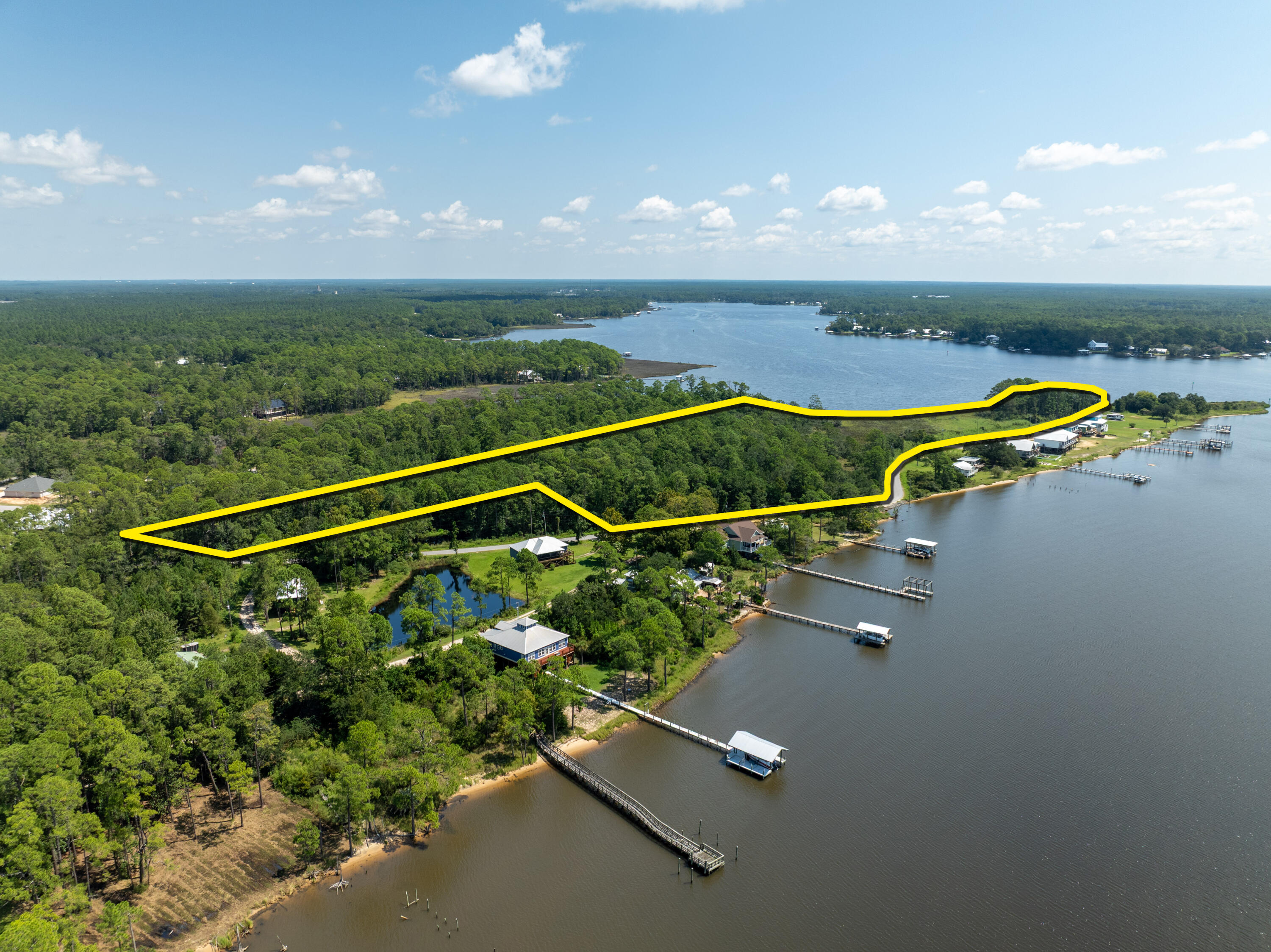 16-acres Beatrice Point Road Freeport, FL 32439 - Photo 3 of 37 an aerial view of a swimming pool with seating area and hardwood floor