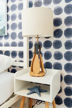 a room with a table and a painting on the wall
