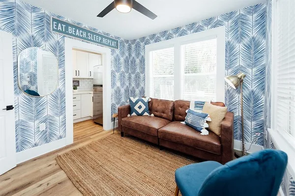 a living room with furniture and a large window