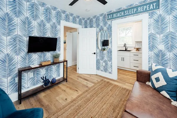 a living room with furniture and a flat screen tv