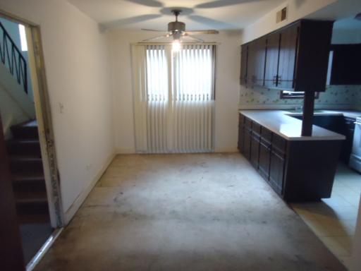 6834 West Lode Drive, Unit 1B Worth, IL 60482 - Photo 3 of 6 a view of a kitchen with granite countertop a sink