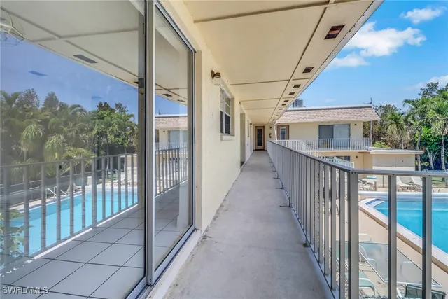 a view of a porch with wooden floor