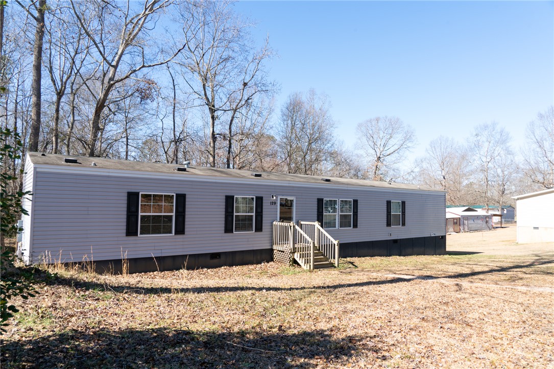 This manufactured home offers a private yard and easy access to nature.