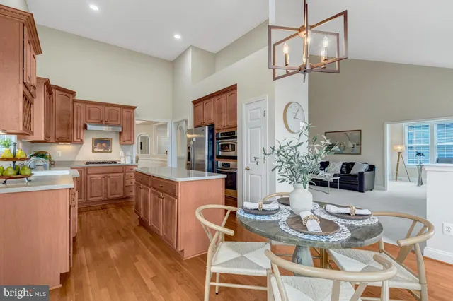 a living room with furniture and a dining table