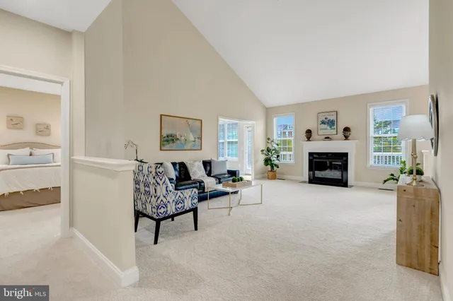 a view of a livingroom with furniture and a window