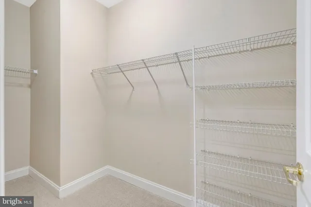 an empty room with closet area