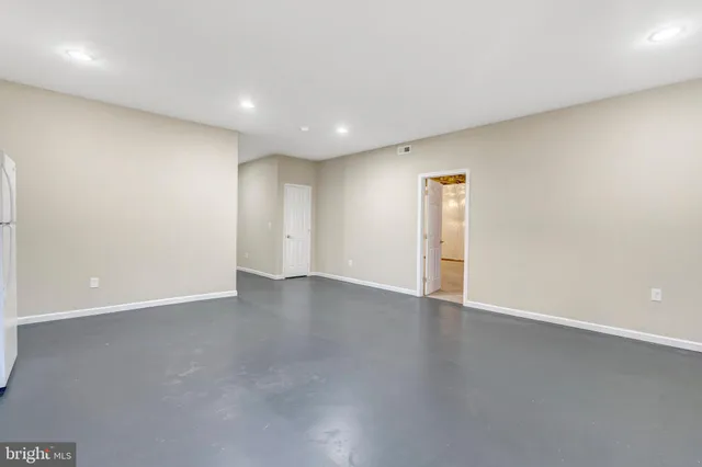 a view of an house with backyard space and balcony