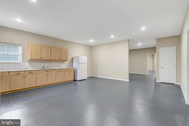 a view of a house with a backyard and a table and chair