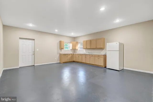 a view of a house with wooden floor and fence