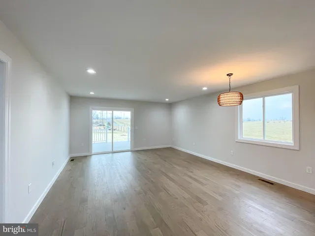 a view of empty room with windows