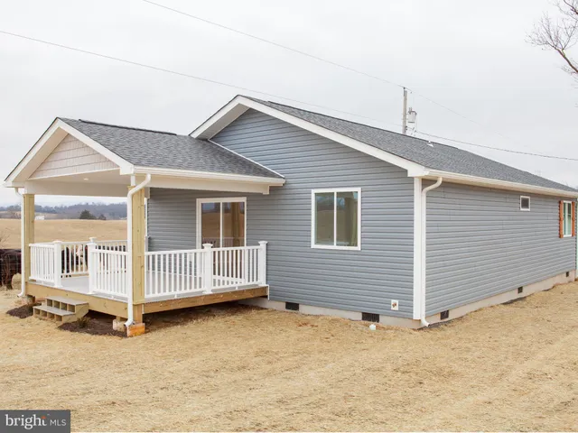 a view of a balcony with furniture