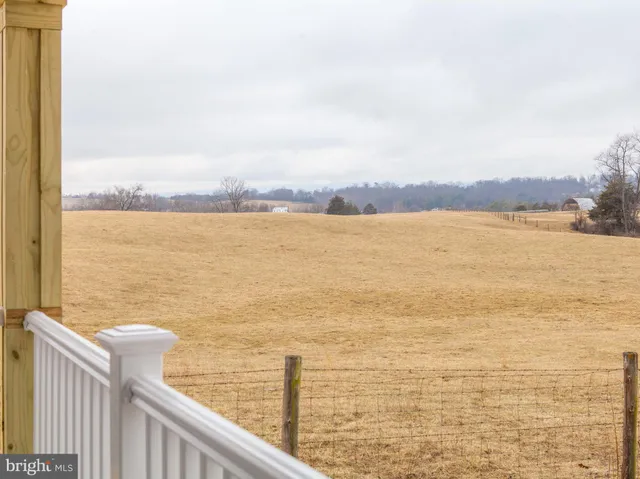 a view of balcony with wooden floor