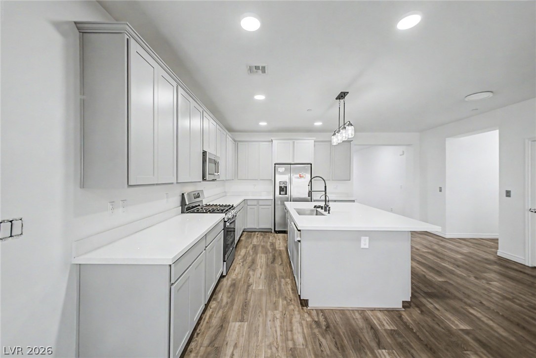 226 Augusta Ridge Henderson, NV 89015 - Photo 8 of 47 This sleek kitchen features clean lines and modern amenities, ideal for culinary exploration and entertaining.