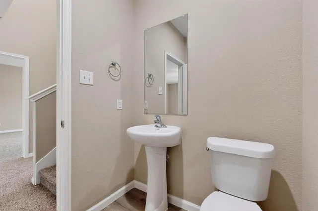 a kitchen with granite countertop stainless steel appliances and refrigerator