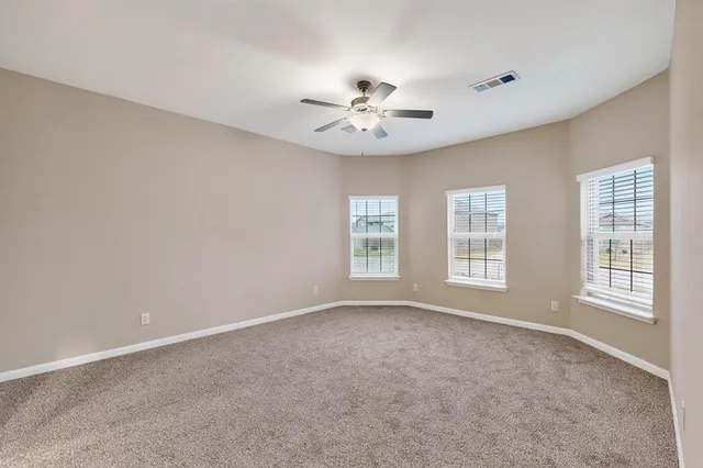 a bathroom with a sink mirror and toilet