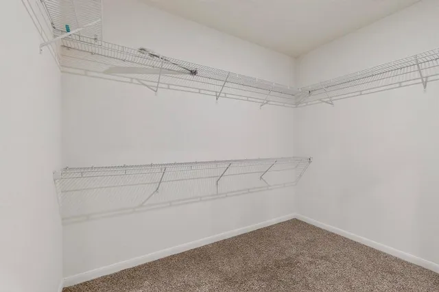a bathroom with a bathtub and cabinets