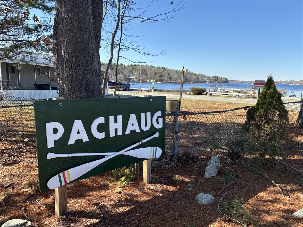 262 Shetucket Turnpike, Unit 112 Griswold, CT 06351 - Photo 16 of 25 a street sign on a pole next to a road