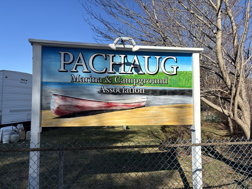 262 Shetucket Turnpike, Unit 112 Griswold, CT 06351 - Photo 24 of 25 a sign that is on a pole