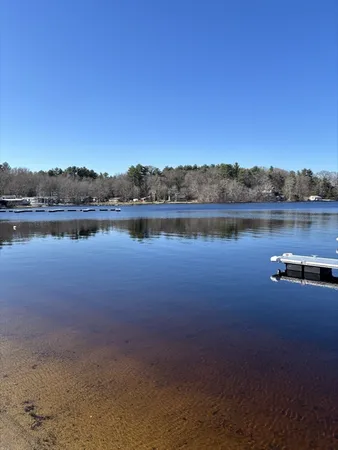 a view of a lake with houses in the back