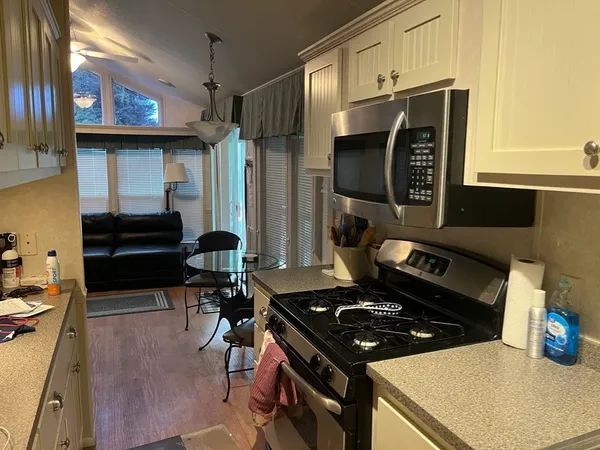 a kitchen with a stove and a refrigerator