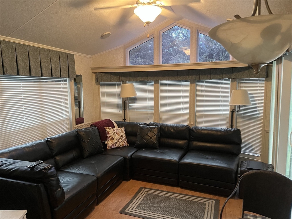 262 Shetucket Turnpike, Unit 112 Griswold, CT 06351 - Photo 7 of 25 a living room with furniture and a window