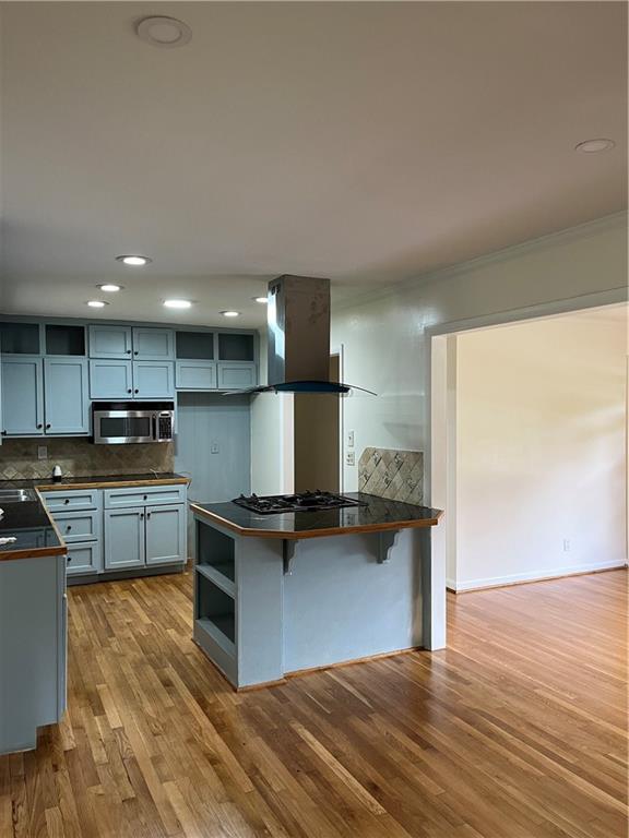 1432 Spring Valley Lane Lilburn, GA 30047 - Photo 6 of 11 a kitchen with stainless steel appliances granite countertop a stove and a refrigerator
